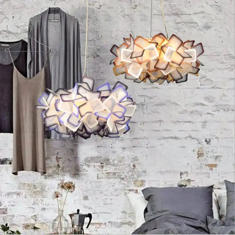 Two hanging decorbites clizia led pendant lights with layered petal shades in warm beige and cool lavender hues