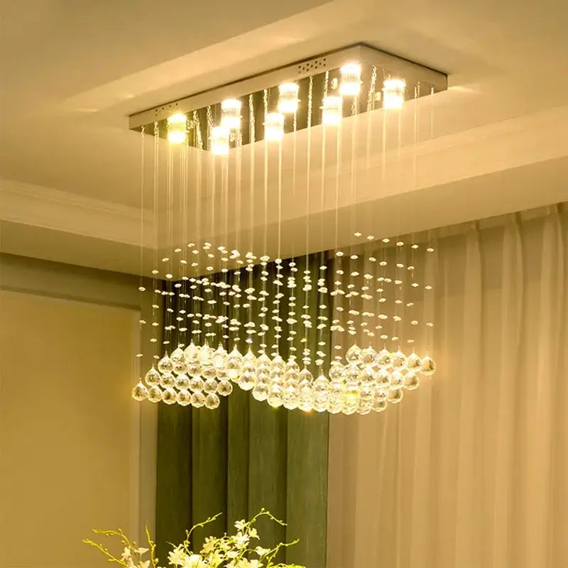 Modern rectangle crystal led chandelier with hanging teardrop crystals and metallic frame for dining room decorbites crystal led