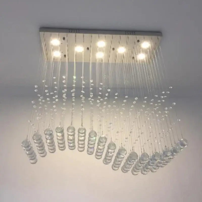 Modern rectangle crystal led chandelier with clear crystal droplets and sleek metallic frame for dining room decorbites crystal led