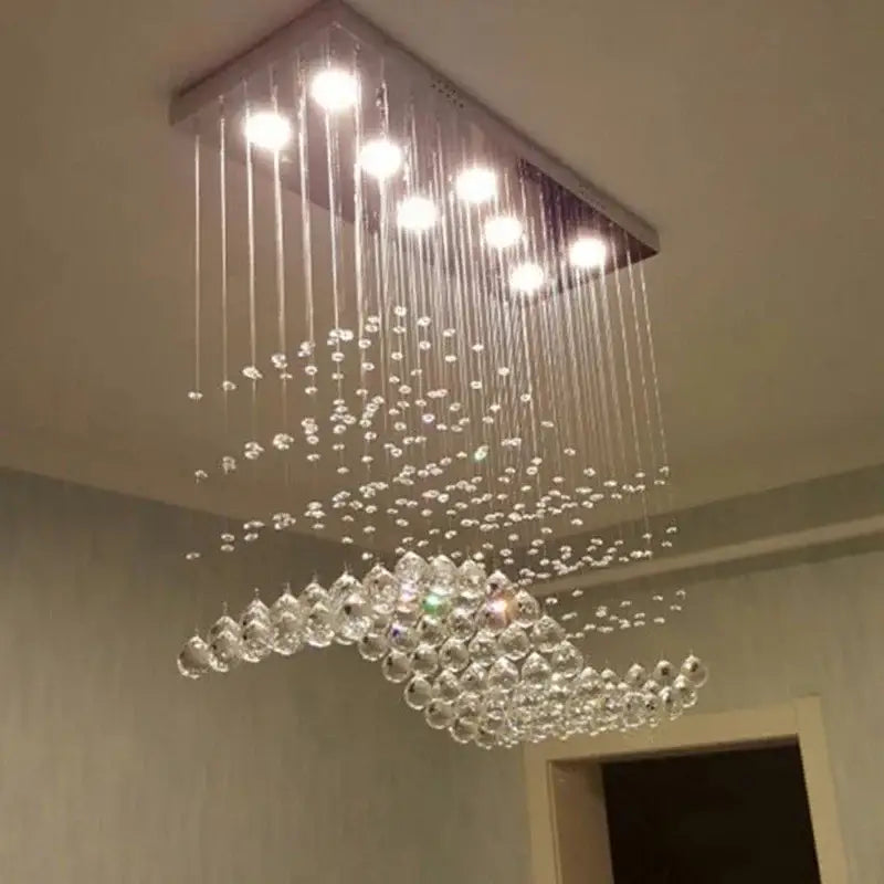 Modern rectangle crystal led chandelier with sleek metallic frame and cascading clear crystal beads for dining room decorbites crystal led