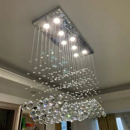 Modern rectangle crystal led chandelier with sleek chrome frame and cascading crystal droplets for dining room decorbites crystal led