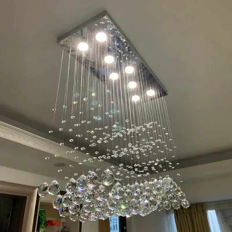 Modern rectangle crystal led chandelier with sleek chrome frame and cascading crystal droplets for dining room decorbites crystal led