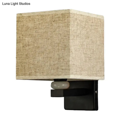Beige linen-textured fabric shade wall light with black metal base and frosted glass accent for faux jade decor bedroom