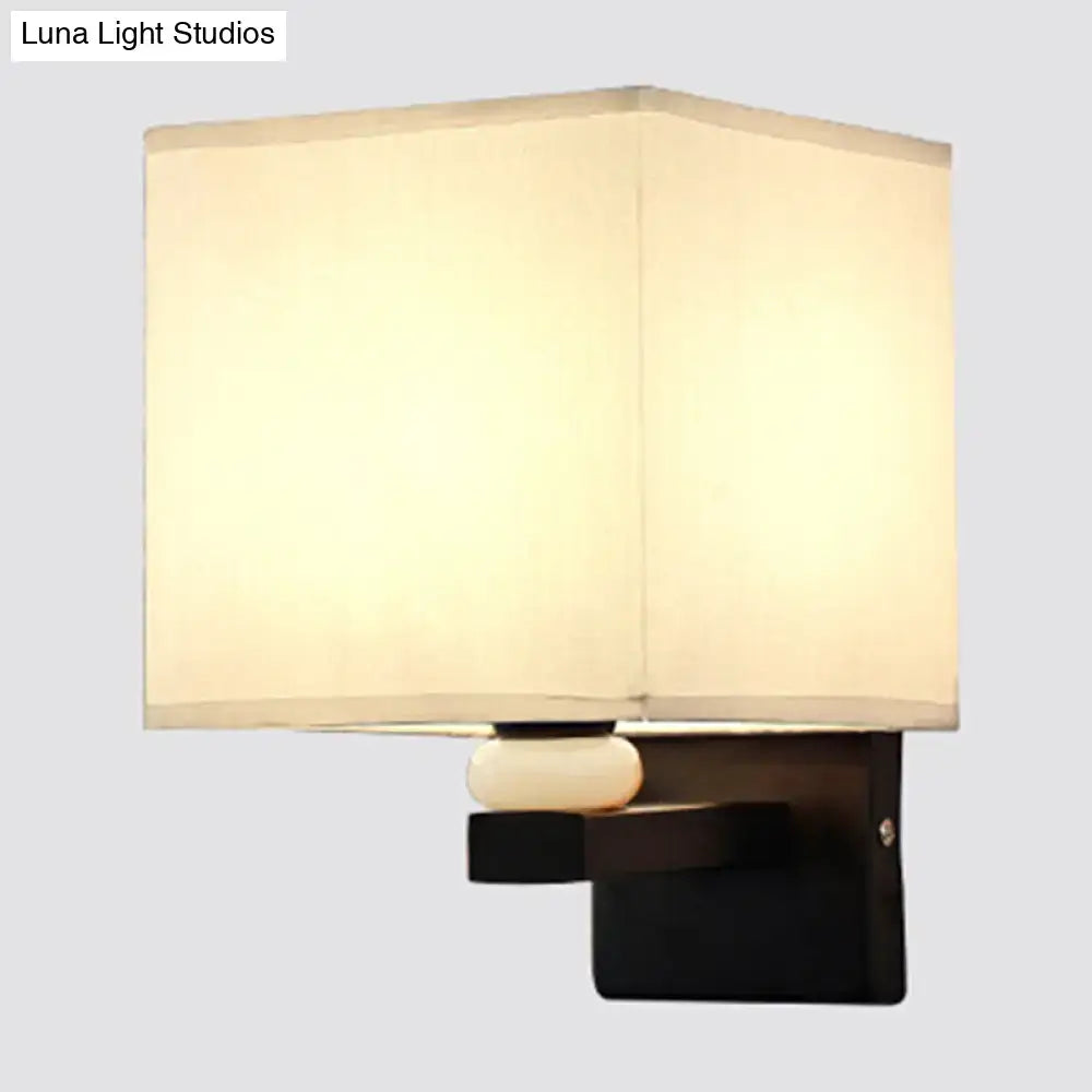 Modern rectangle fabric shade wall light with cream fabric shade black metal base and faux jade decor for bedroom