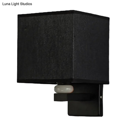Modern black square wall light with textured fabric shade and sleek metal base for faux jade decor bedroom