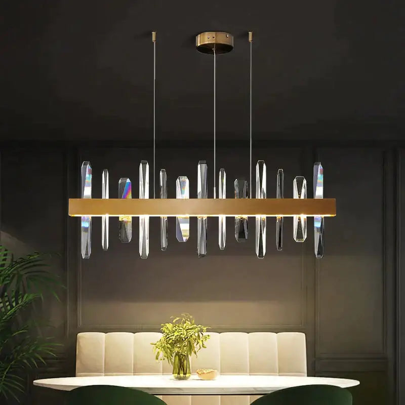 DecorBites Kyala modern rectangle gold crystal chandelier with gold-toned frame and hanging crystal prisms