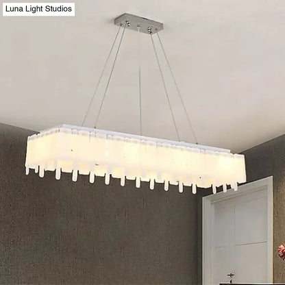 DecorBites™ adjustable acrylic led island pendant light with sleek chrome mount and hanging cord features warm diffuser panels