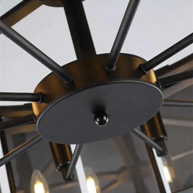 Modern rectangular black crystal chandeliers with industrial-style black and brass-toned metal arms for dining room decorbites crystal chandeliers