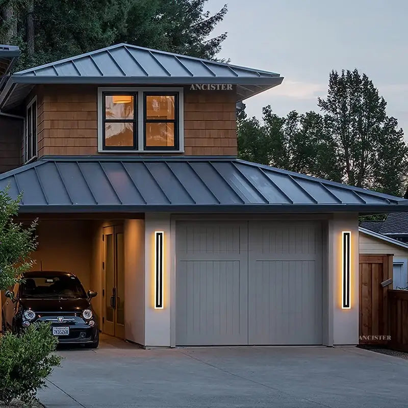 The modern rectangular black led waterproof wall light complements a house with gray metal roofing and wood siding