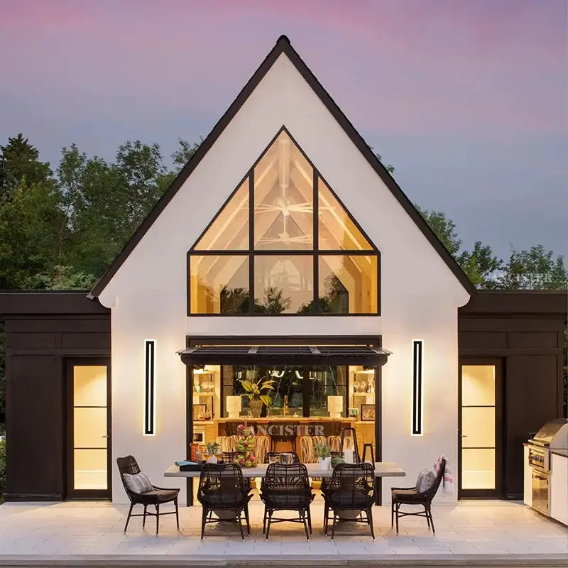 Modern rectangular black led waterproof wall light mounted on white a-frame house with black trim and large window