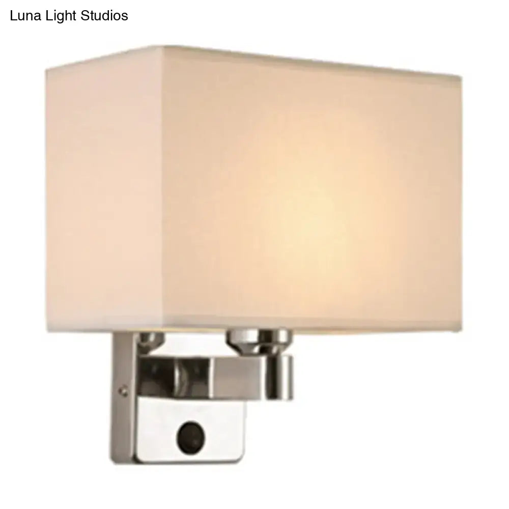 Modern rectangular chrome wall sconce with white beige fabric shade and polished metal base for bedroom lighting