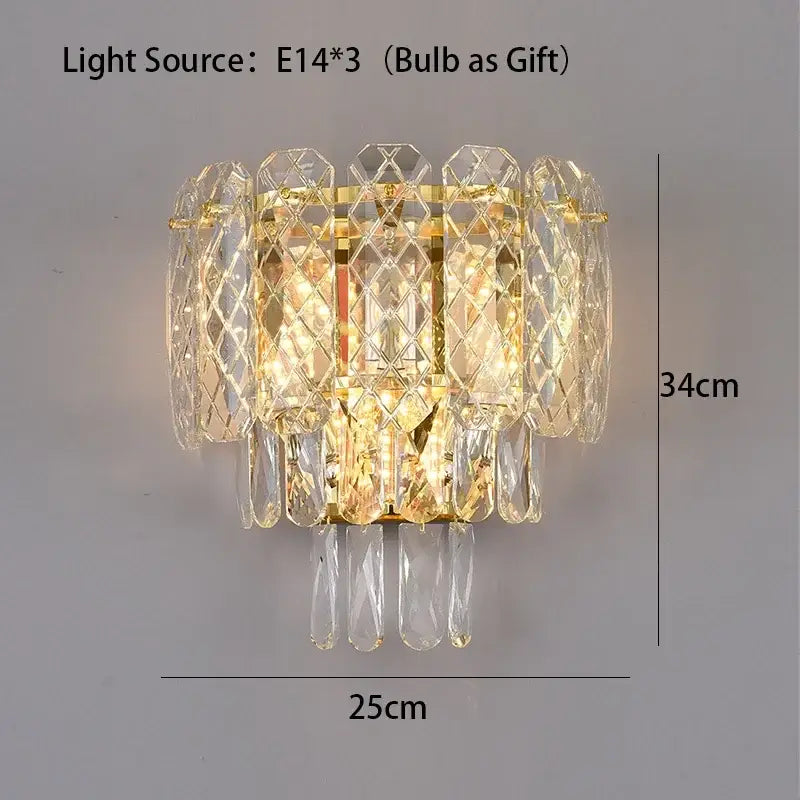 Gold-toned crystal led wall sconce with tiered faceted design and dangling teardrop crystals for modern decorbites lighting fixture