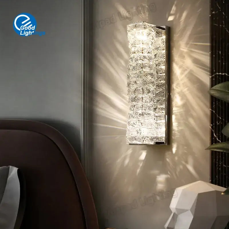 Modern rectangular crystal wall lamp with stacked segments refracting warm white light for bedroom decorbites crystal wall sconce