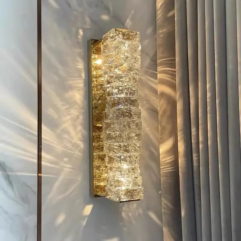 Modern rectangular crystal wall sconce with stacked faceted crystals and gold metal backing for bedroom decorbites crystal wall lighting
