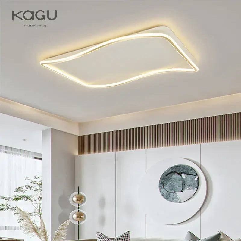 Modern rectangular golden led ceiling chandelier with sleek curved led edge emitting warm white illumination for living room decorbites golden led