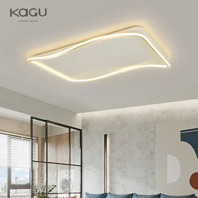 Modern rectangular golden led ceiling chandelier with sleek curved edge emitting warm white light for living room decorbites golden led