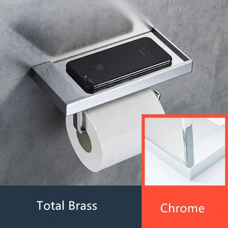 Modern rectangular chrome finished metal toilet paper holder with integrated shelf holding a black smartphone