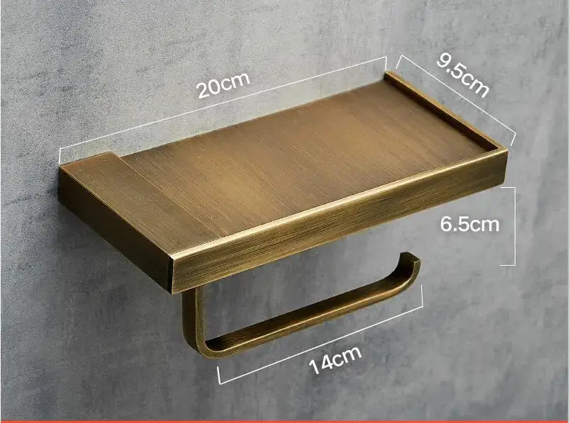 Brass-finished wall-mounted modern rectangular metal toilet paper holder with integrated shelf for bathroom use