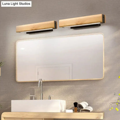 Two sleek rectangular wooden vanity lights with black metal bases mounted above a mirror modern led sconce fixture height