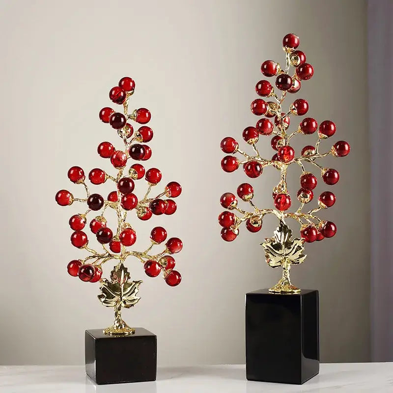 Two identical modern red and gold grape vine metal sculptures with glossy red orbs on black bases for living room decorbites grape vine decor