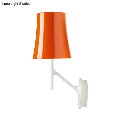 Modern red and white barrel wall mount sconce featuring a vibrant orange conical lampshade on a sleek metallic fixture