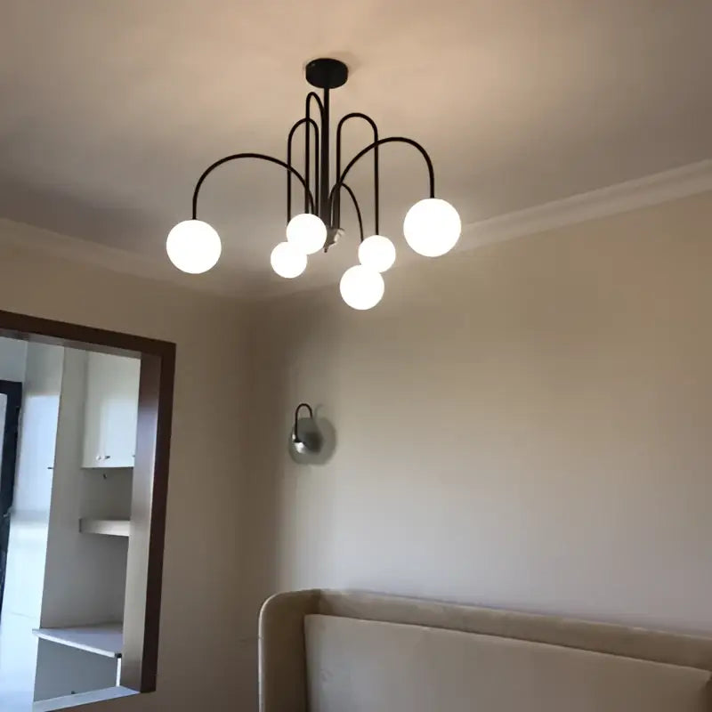 Black metal chandelier with six white globe lights as a modern decorbites branch glass pendant for living room
