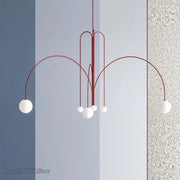 Modern red and white branch glass pendant lights featuring curved arms and spherical glass globes for living room decor