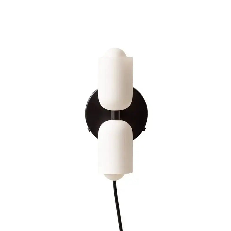 Modern red and white double head glass wall light with off-white matte cylindrical shades on black base for bedroom