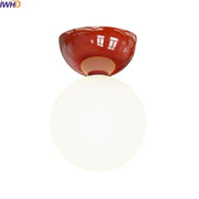 Modern red and white iron glass led ceiling lights featuring a red glossy ceramic base and white spherical glass globe by decorbites