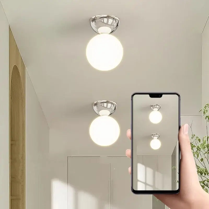Modern chrome-finished iron glass led ceiling lights with spherical frosted glass globe for bedroom decorbites iron glass