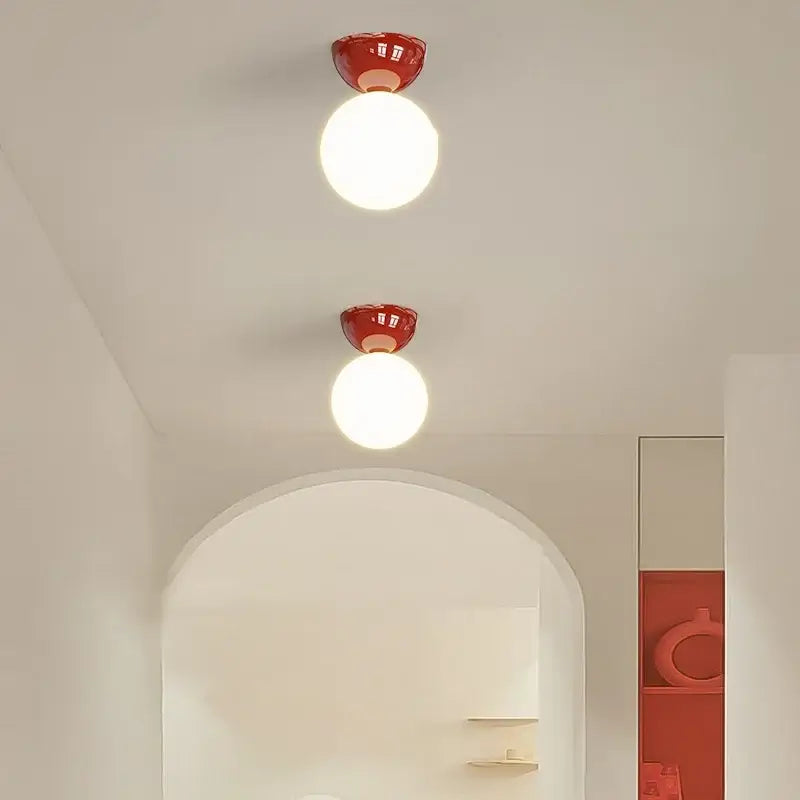 Modern red and white iron glass led ceiling lights featuring two red ceramic flush-mount fixtures with white glass shades