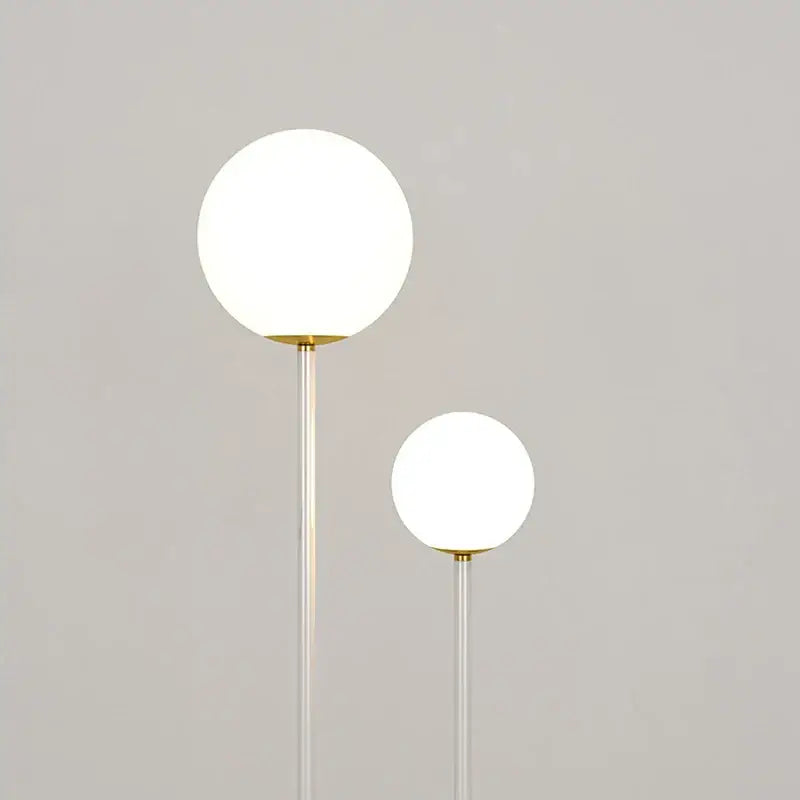 Modern red and white metal floor lamp with dual frosted glass spheres and slender stems for living room decorbites black white metal