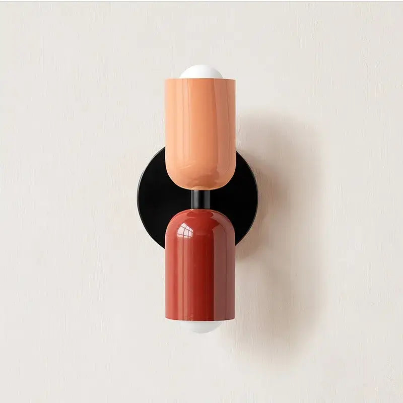 Modern red and black glossy led wall lamp with matte peach and terracotta two-toned design and black hardware for decor