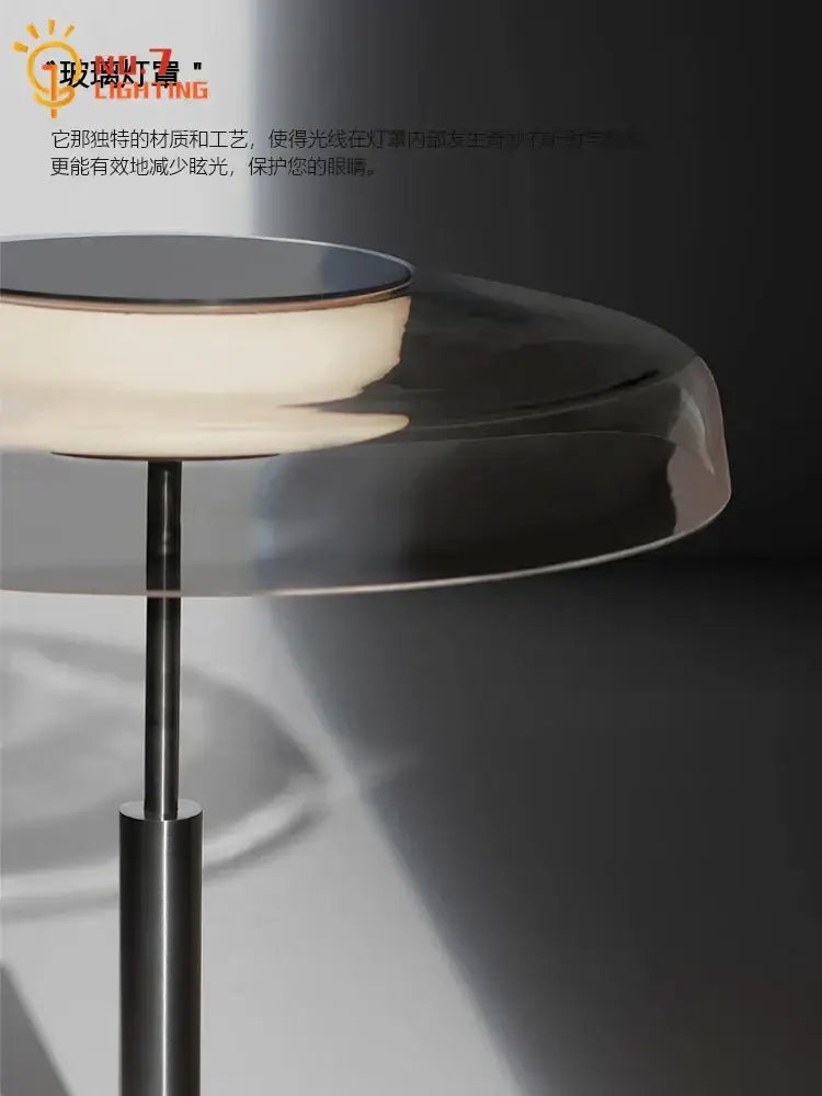 A modern floor lamp with a translucent glass shade and polished metallic base for decorbites dora stained glass decor