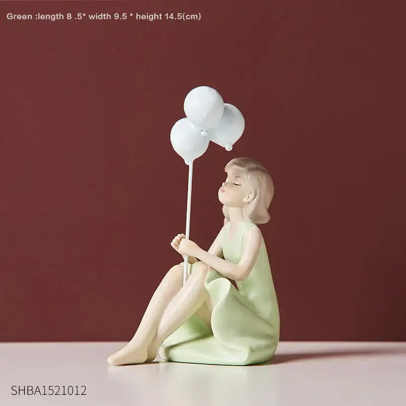 A delicate light green balloon girls resin figurine of a seated girl holding white balloons for living room decor