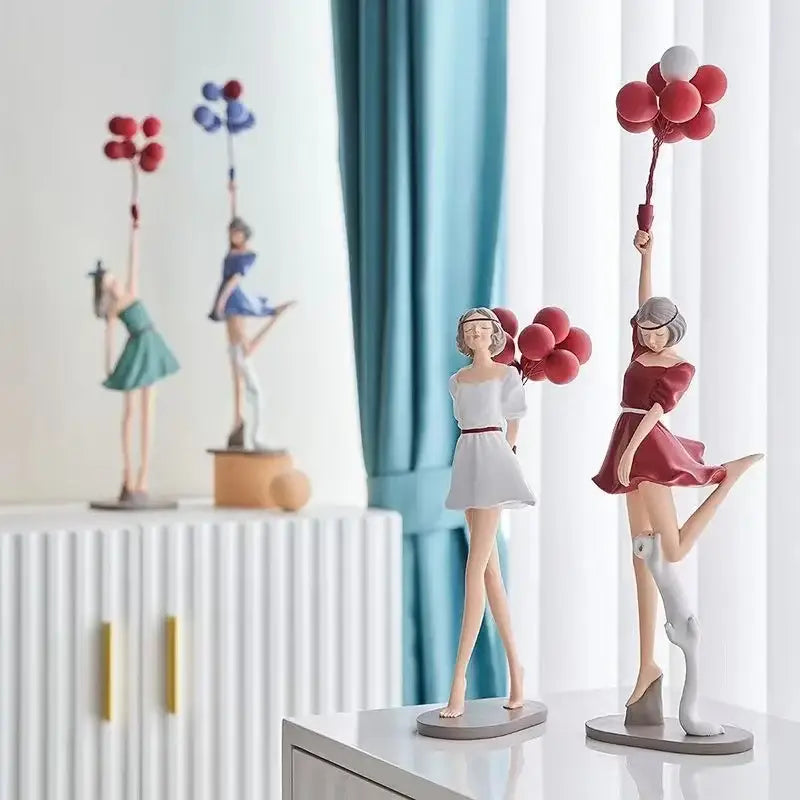 Modern red and blue balloon girls resin figurines featuring a red dress girl holding balloons with a white cat at her feet