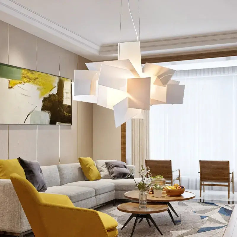 Modern white geometric pendant lamps with layered angular panels complement decorbites acrylic leaf dining room light