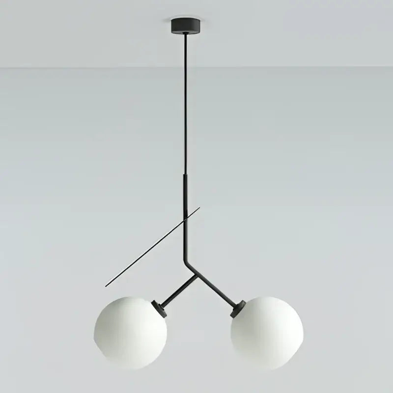Modern black metal pendant light with two frosted white spheres complementing decorbites cherry led pendant light