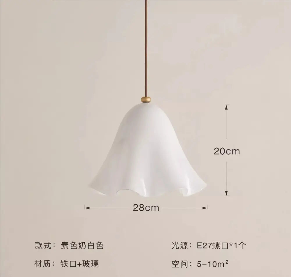 A delicate white glass pendant light with a fluted bell-shaped shade and brass suspension for modern interiors