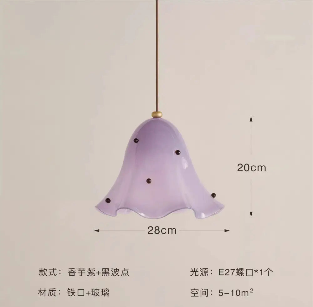 Modern lavender glass pendant light with black dot accents and brass suspension ideal for dining room pendant lights