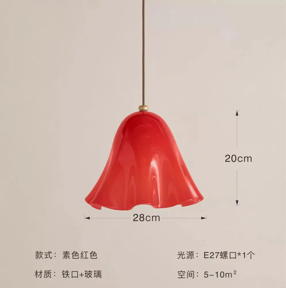 Modern red glass pendant light with black dots featuring a glossy bell-shaped glass pendant and iron frame for dining rooms