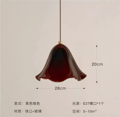 Modern red glass pendant light with black dots featuring a glossy deep burgundy glass pendant and iron suspension for dining room