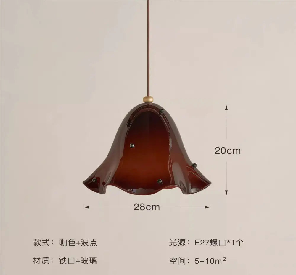 Modern glass pendant light with deep brown fluted glass and iron frame ideal for dining room pendant lights