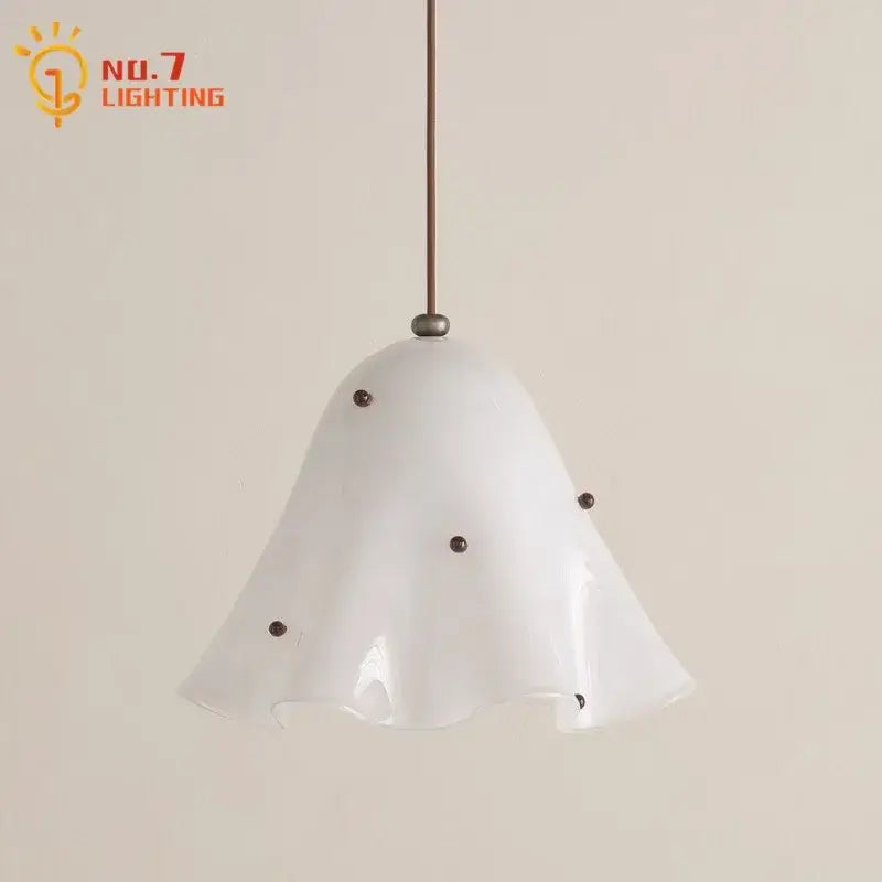 Modern white frosted glass pendant light with fluted bell-shaped shade and dark metal accents for dining room use