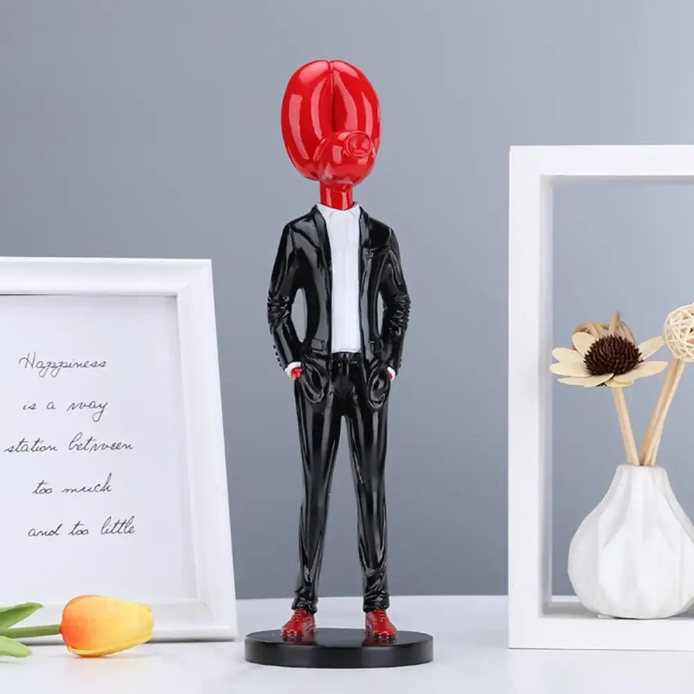 Modern red glossy balloon dog statue resin figurine resembling a coffee bean head in black suit for living room decor