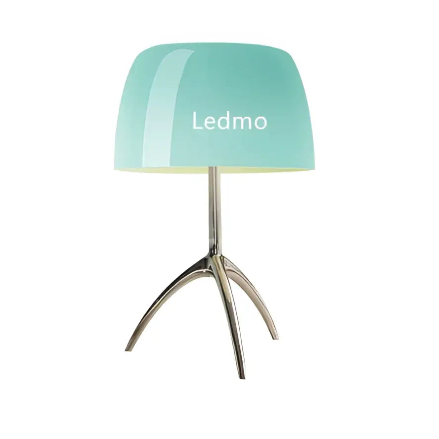 A sleek mint green glass shade table lamp with a metallic tripod base branded ledmo for modern bedroom lighting