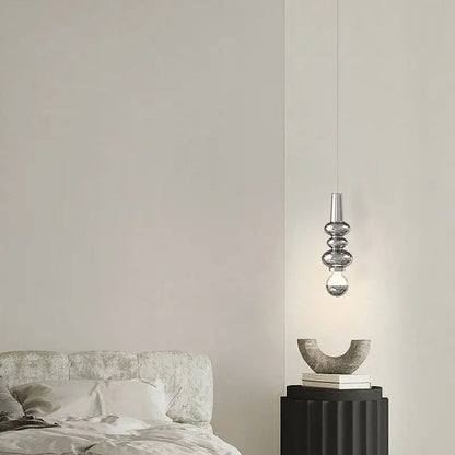 Modern red and green caterpillar iron led pendant light with sleek silver metallic finish and stacked glass elements by decorbites caterpillar iron