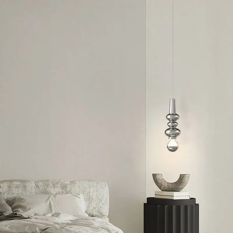 Modern red and green caterpillar iron led pendant light with sleek silver metallic finish and stacked glass elements by decorbites caterpillar iron