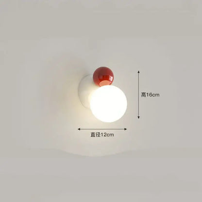 Modern red and green led wall light featuring a spherical white acrylic base with a red accent by decorbites led wall