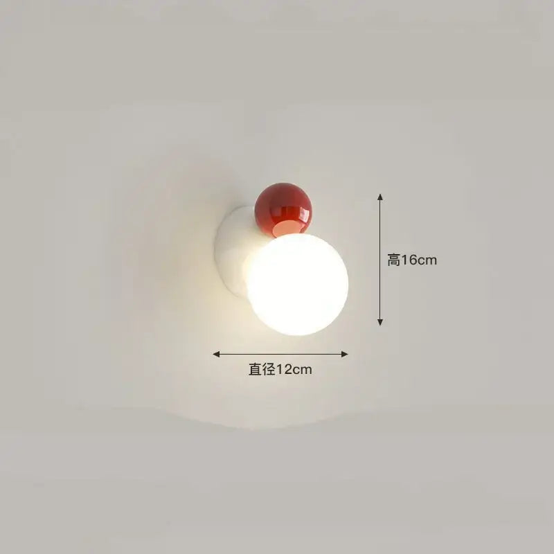 Modern red and green led wall light featuring a spherical white acrylic base with a red accent by decorbites led wall